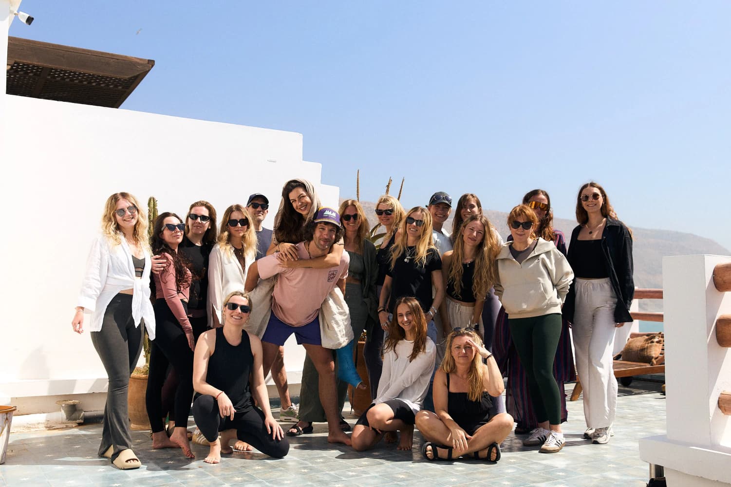 Rooftop yoga group portrait at Aman Surf & Yoga in Imsouane, Morocco