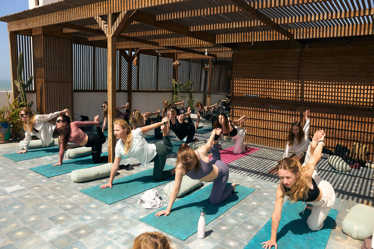 Rooftop yoga flow at Aman Surf & Yoga in Imsouane